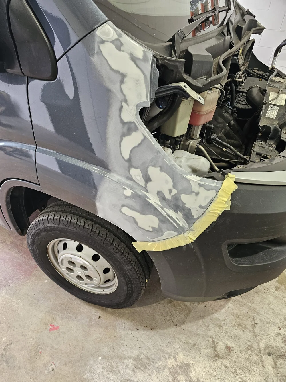 Van front wing — accident repair in preparation