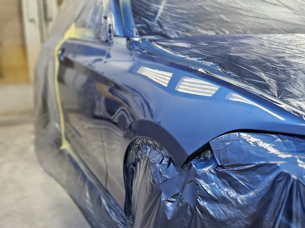 Metallic blue — front wing refinished