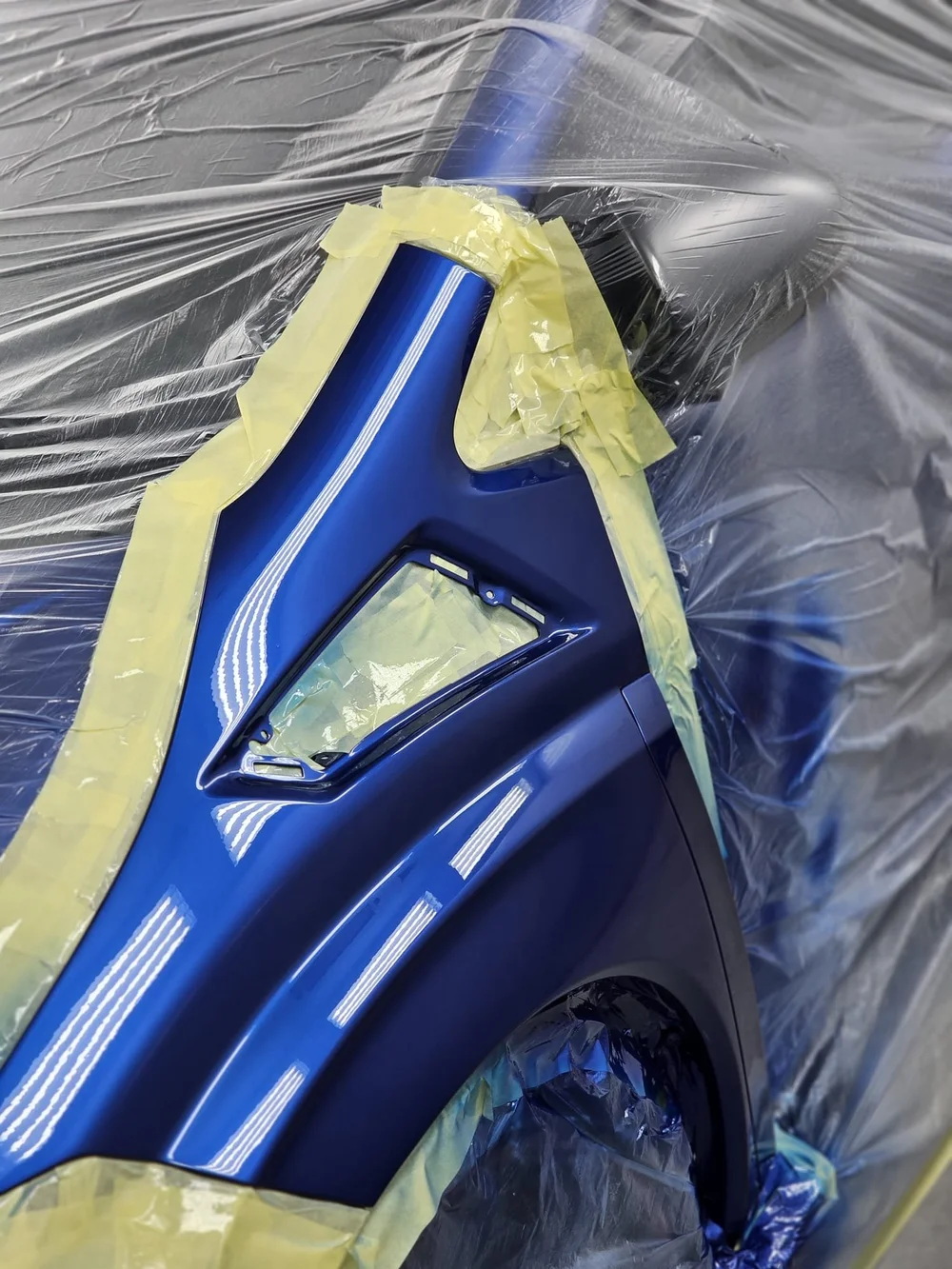Deep blue — bumper and wing detail